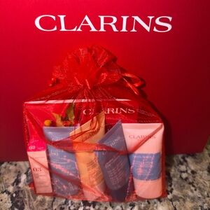 Clarins Skincare Collection in Vibrant Red Bag